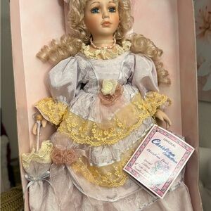 Charming Porcelain Doll with Yellow and Cream Dress